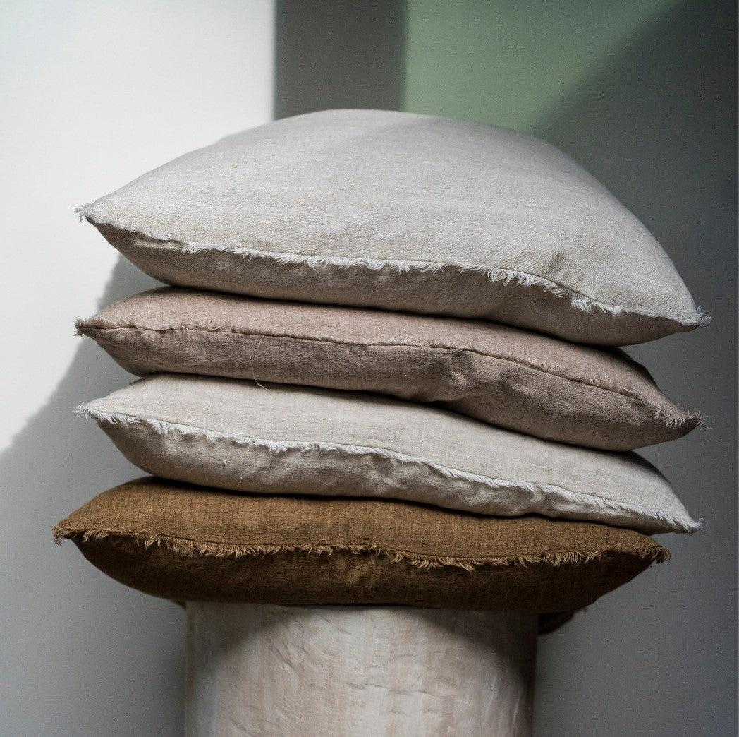 Oat Linen Pillow: from our Lina collection. Luxury pillows in Canada. Third pillow from the top with 3 stacked pillows