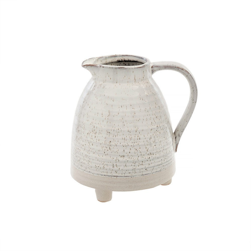 The Alchemy footed pitcher: a versatile stoneware vase with a bespeckled reactive glaze, perfect for serving or as a decorative piece.