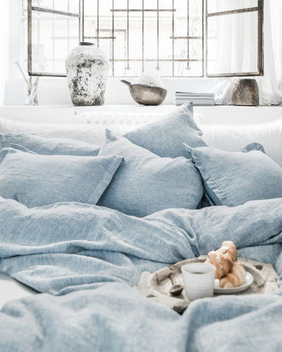 Linen Duvet Cover Blue Melange - shown on bed with pillows. Shop Magic Linen duvets in Canada at Avalon Willow Home.