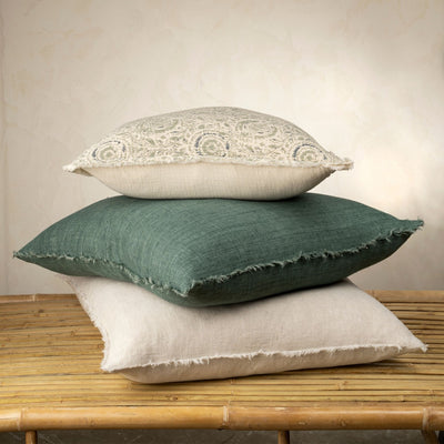 Clemente Pillow - Blue Green 20x20 on top of larger pillows