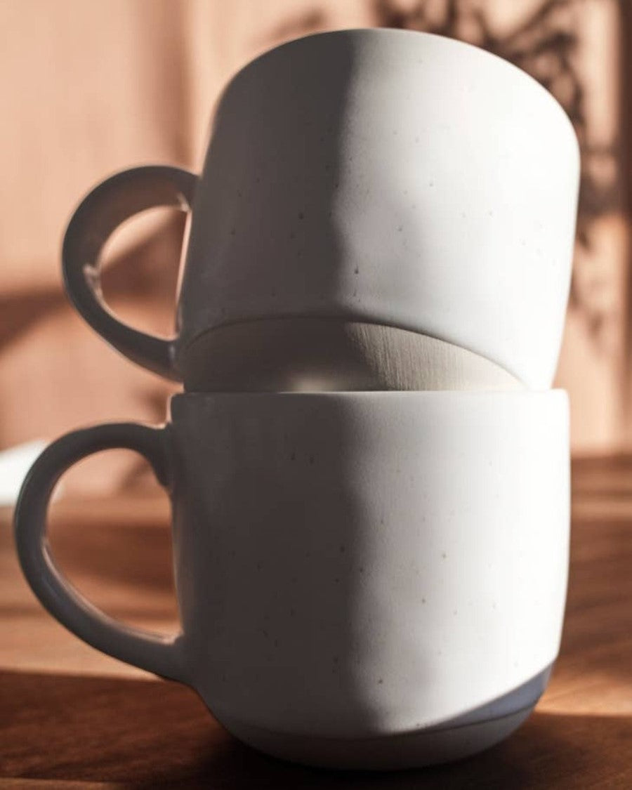 High-quality crockery mugs, 2 stacked together. Each holds 16oz of fluid. Brand: Fable. 
