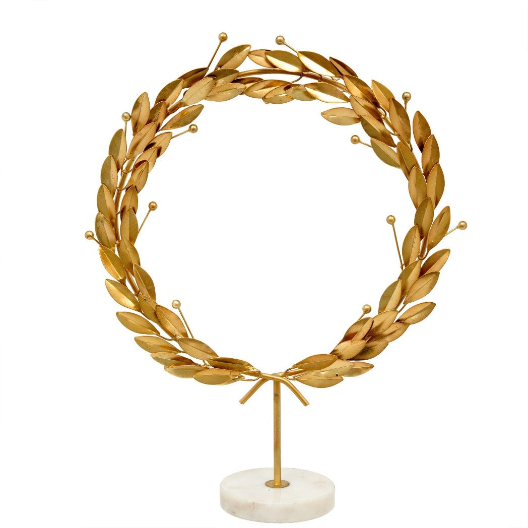 Grecian Wreath on Stand: Golden iron leaves on a white marble base. inspired by a classic Laurel Wreath.