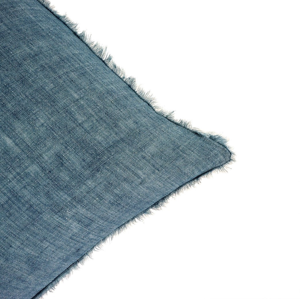 Frayed edge of Artic Blue Linen Pillow, measures 24x24. Part of our Lina Linen Pillow collection.