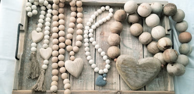 Indaba 7-9809 Wooden Prayer Beads with Concrete / Cement Heart - affordable decor - with others on tray