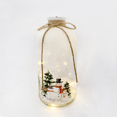 Light-up snowman LED Christmas bottle creating cozy festive ambiance