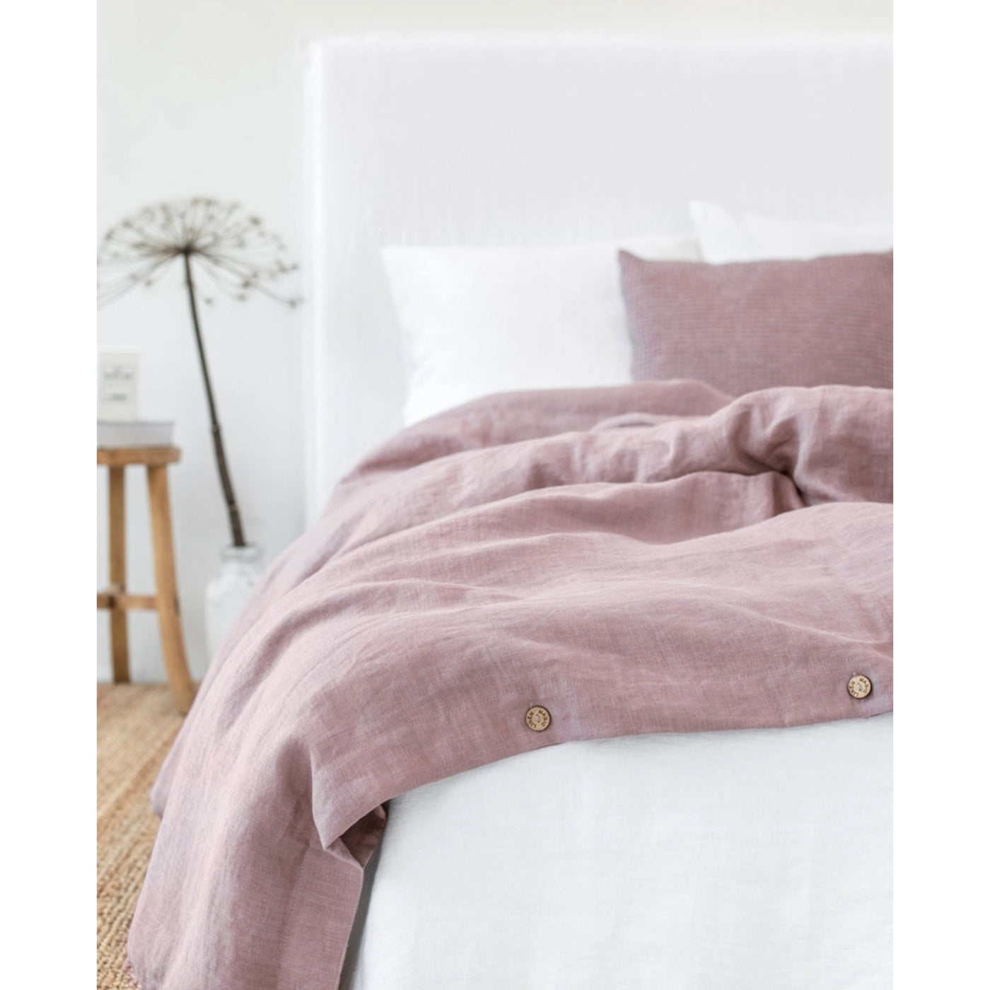 Linen Duvet covers: Dusty Pink - Woodrose color, with coconut buttons & interior ties, displayed on bed in bedroom. ML-DUVETC-000-230-220-WD by Magic Linen brand.