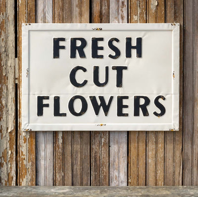 Metal Fresh Cut Flowers Sign: #EWA80544, 28x20 inches sign hung on rustic wooden wall.
