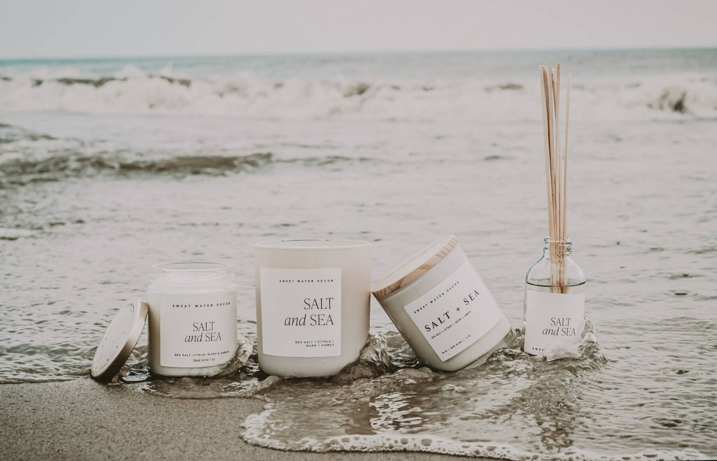 Salt & Sea soy candles on beach shore