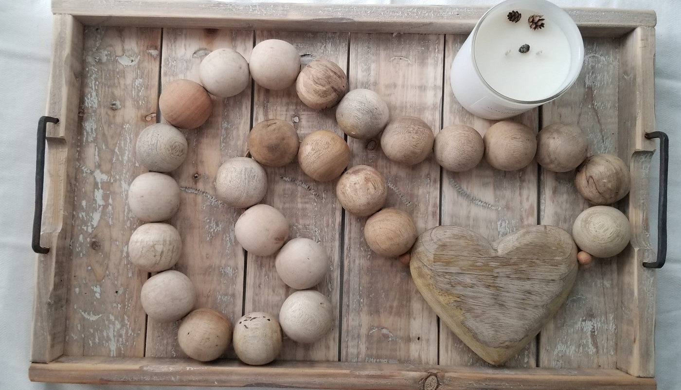 Wooden tray in Rustic Whitewash color, displaying home decor and candle.