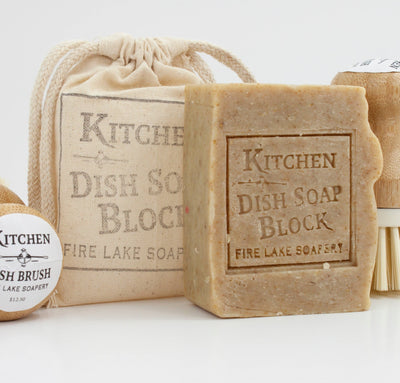 Kitchen Dish Soap Block & Cloth Bag: a natural, eco-friendly solution for a clean kitchen. Made with olive, coconut, and rosehip seed oil, it fights grease, grime, and stains.