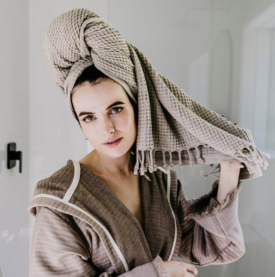 Clay color Stonewashed Waffle towel wrapped in woman's wet hair