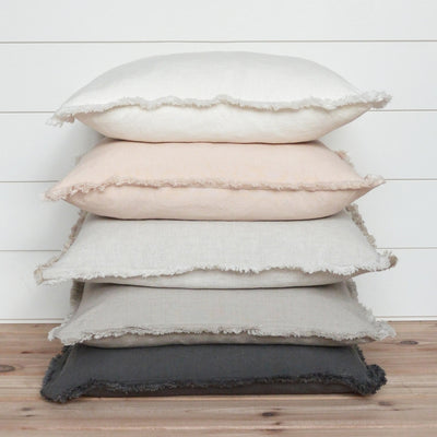 Light Grey 26" pillow, side view of fringed stacked pillows